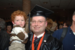 photograph of graduating student in gown and cap
