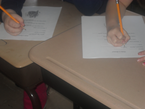 File:Writing on worksheet.png