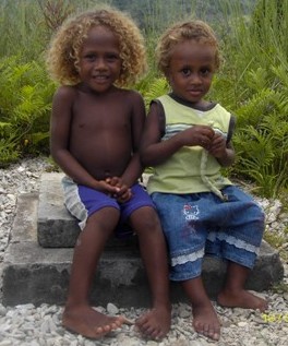 A photo of my two children sitting on the well